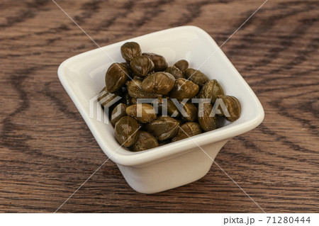 Tasty capers in the bowl Tasty capers in the bowl 71280444