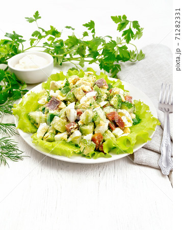 Salad of salmon and avocado on table 71282331