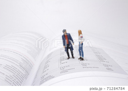 a mini figure stand on the open book a mini figure stand on the open book 71284784