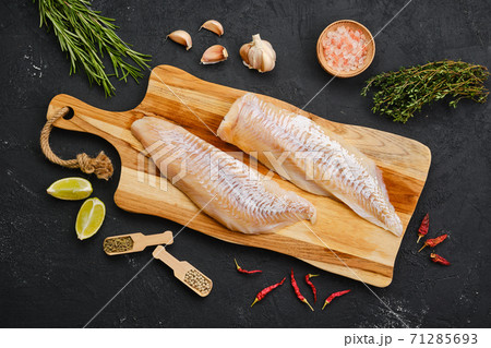 Top view of haddock fillet with seasoning 71285693