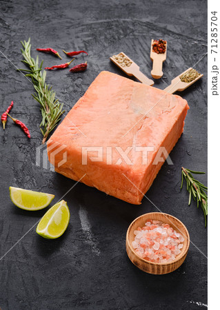 Raw pieces of salmon pressed in briquette 71285704