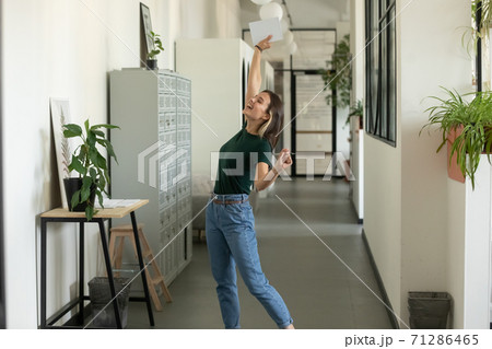 Overjoyed millennial female manager feeling happy of signing profitable contract Overjoyed millennial female manager feeling happy of signing profitable contract 71286465