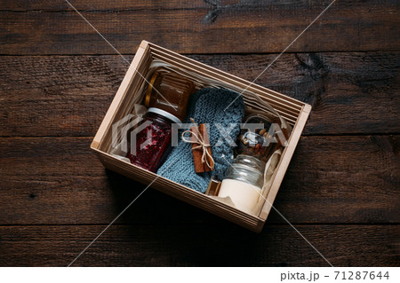 Care box, package ideas. Fall or Winter care box with sweets and warm clothes. Care Package Delivery, Fall Winter holidays Food Care gift box 71287644