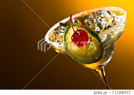Alcoholic cocktail with cherry and lime. Alcoholic cocktail with cherry and lime. 71288052