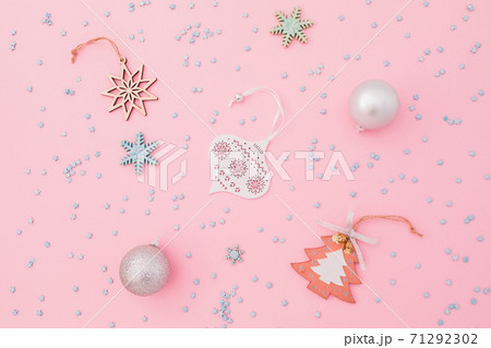 Christmas composition made of silver decoration and confetti on pink background. Flat lay, top view. Christmas composition made of silver decoration and confetti on pink background. Flat lay, top view. 71292302