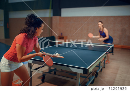 Women play ping pong match, table tennis 71295926