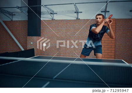 Man hits the ball, table tennis, ping pong player Man hits the ball, table tennis, ping pong player 71295947