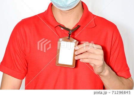 Man holding empty Identification ,white blank employee id card mockup Man holding empty Identification ,white blank employee id card mockup 71296845