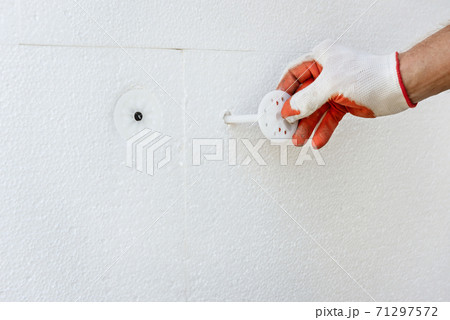 Insulation of the house with polyfoam. 71297572