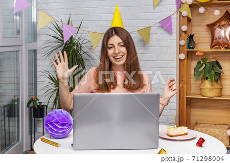 Woman celebrating birthday at home and communicate by video chat Woman celebrating birthday at home and communicate by video chat 71298004