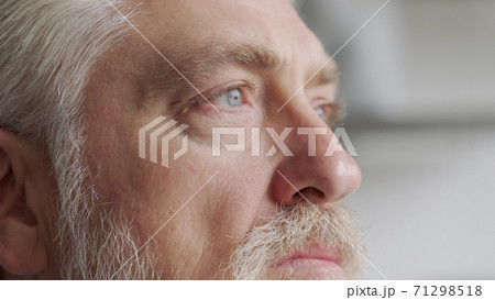 Old man's eyes closeup footage: pensive old man thoughtful elder Old man's eyes closeup footage: pensive old man thoughtful elder 71298518