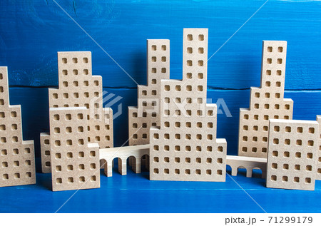 A large city of skyscrapers and overpass flyovers made of figures. Real estate concept. Urbanism and infrastructure. Urbanization, dense high-rise building. Megapolis. City management. Downtown A large city of skyscrapers and overpass flyovers made of figures. Real estate concept. Urbanism and infrastructure. Urbanization, dense high-rise building. Megapolis. City management. Downtown 71299179