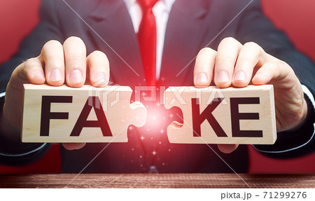 A man breaks a fake puzzle. Exposing fake news and false info. Debunking myths. Investigation of doubtful facts, information hygiene. Timely refutation. Stop influencing public opinion 71299276