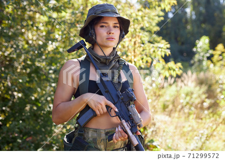 caucasian attractive hunter female in top going to hunt on birds and deers in wild forest caucasian attractive hunter female in top going to hunt on birds and deers in wild forest 71299572