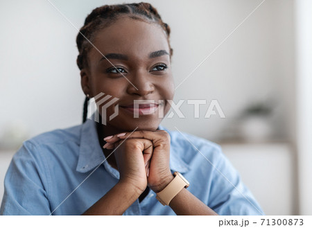 Closeup Portrait Of Dreamy Young Black Woman With Braids Looking Away Closeup Portrait Of Dreamy Young Black Woman With Braids Looking Away 71300873
