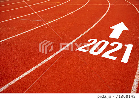 Start line to 2021 on running court represents the beginning of a journey to the destination in business planning, strategy and challenge or career path, opportunity. 71308145