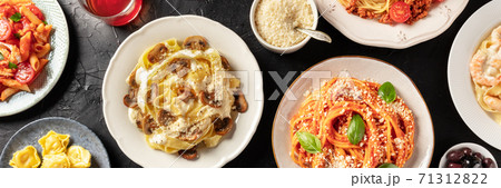 Pasta. Overhead panoramic shot of traditional Italian dishes. Mushroom pappardelle, tomato spaghetti, ravioli, with grated Parmesan cheese 71312822