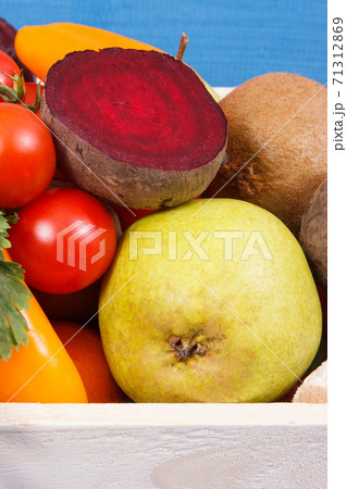 Fresh ripe fruits with vegetables as healthy nutritious snack or dessert containing vitamins 71312869