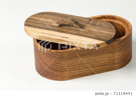 Natural wood round handmade box, olive tree box isolated on white background Natural wood round handmade box, olive tree box isolated on white background 71319441