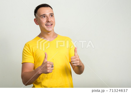 Portrait of handsome man with yellow shirt Portrait of handsome man with yellow shirt 71324637