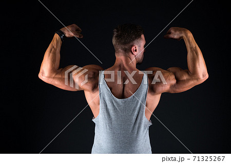 Lets get that body trained. Fit guy flex arms showing biceps triceps. Muscle power. 71325267