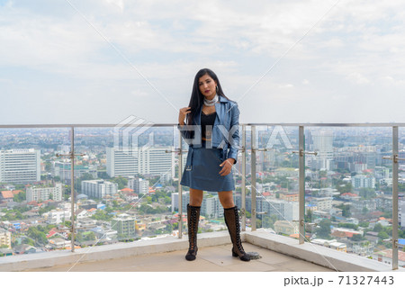 Portrait of beautiful young woman outdoors at rooftop 71327443