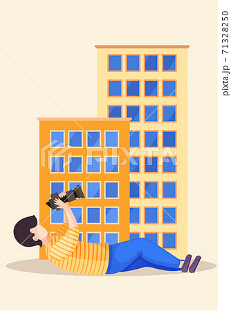 The guy lying and adjusting the lens. Photographer with camera takes pictures of a buildings The guy lying and adjusting the lens. Photographer with camera takes pictures of a buildings 71328250