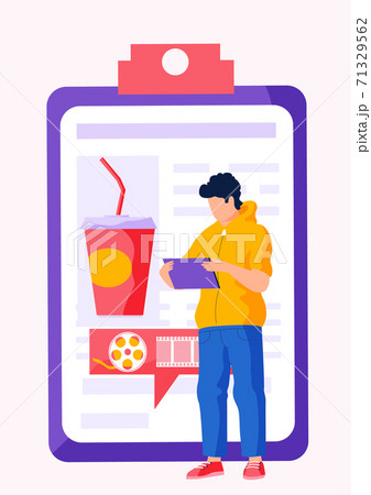 A man stands and works on a tablet with folder with photo of a cocktail and text on the background 71329562