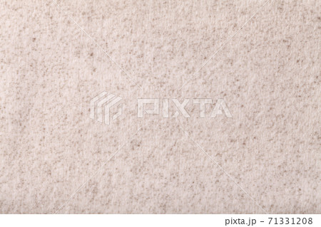Light beige fluffy background of soft, fleecy cloth. Texture of cream textile. 71331208