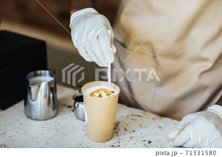 Drawing on cappuccino in modern coffee shop 71331580