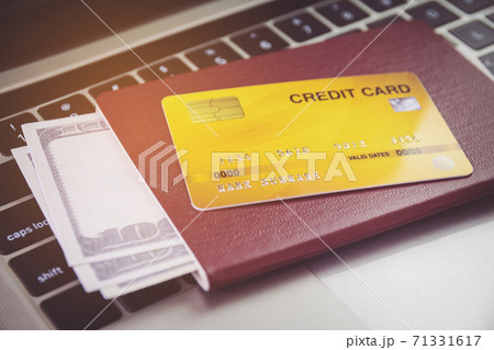 Credit card and passports near laptop computer on table. Online ticket booking concept 71331617