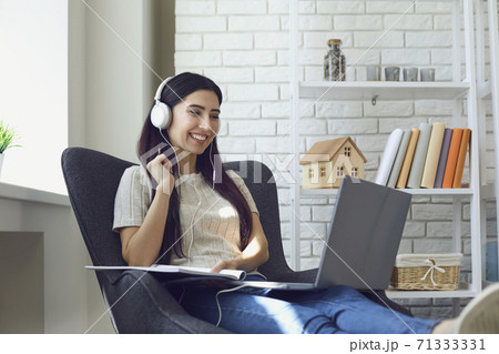 Young woman student attend online class, webinar or internet lecture from home using laptop computer Young woman student attend online class, webinar or internet lecture from home using laptop computer 71333331