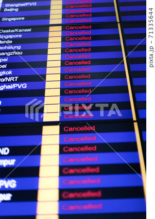 Sign cancelled on arrival and departure board in airport terminal 71335644
