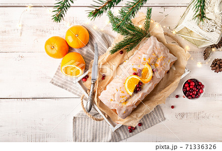 Christmas orange cake with cranberries and sugar icing Christmas orange cake with cranberries and sugar icing 71336326