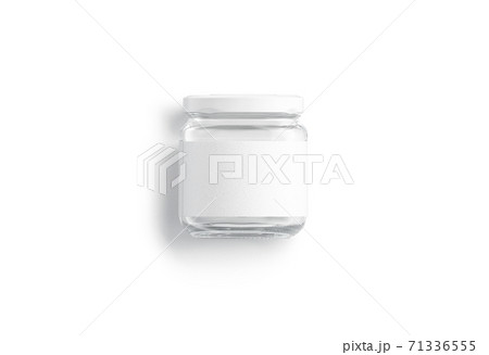 Blank small glass jar with white label mockup lying, isolated 71336555