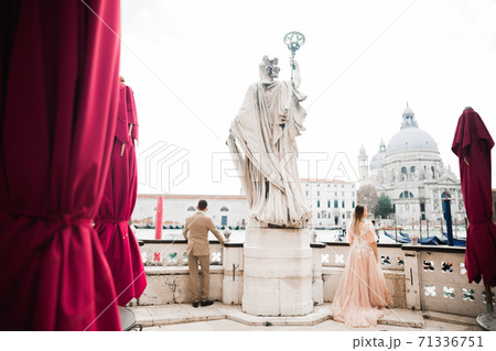 Wedding couple spending their time in Venice, Italy. Honeymoon Wedding couple spending their time in Venice, Italy. Honeymoon 71336751