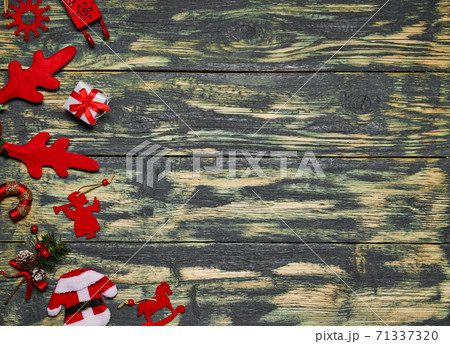 Christmas decorations on wooden table with space for text. Christmas decorations on wooden table with space for text. 71337320