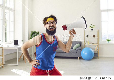 Funny fitness geek with megaphone shouting about amazing sale at the sports store Funny fitness geek with megaphone shouting about amazing sale at the sports store 71338715