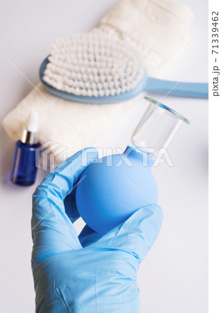 hand with vacuum jar. set for massage with vacuum jars and and massage brush. anti-age and anti-cellulite set for home procedure. beauty consept hand with vacuum jar. set for massage with vacuum jars and and massage brush. anti-age and anti-cellulite set for home procedure. beauty consept 71339462