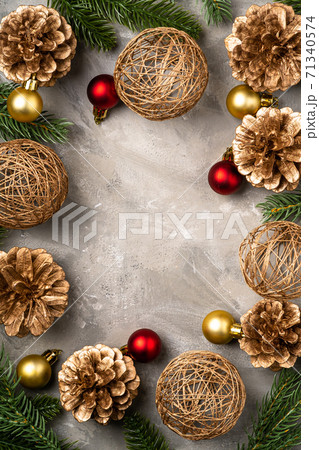 Christmas composition. Golden ornament, pine cones and fir needles decorations. Copy space 71340574