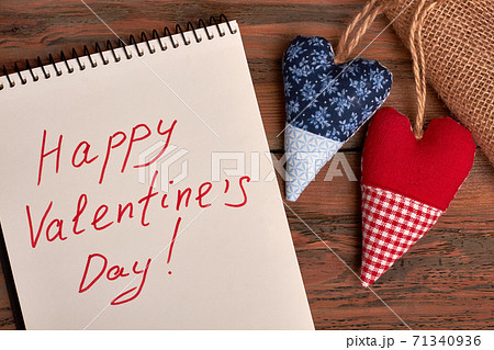 Valentine's greeting paper on wood. 71340936