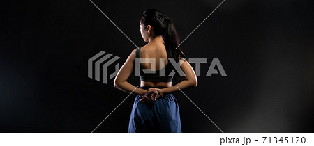 TaeKwonDo Karate teenager athlete kick punch black background isolated 71345120