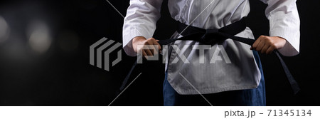 TaeKwonDo Karate teenager athlete kick punch black background isolated TaeKwonDo Karate teenager athlete kick punch black background isolated 71345134