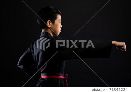 TaeKwonDo Karate teenager athlete kick punch black background isolated TaeKwonDo Karate teenager athlete kick punch black background isolated 71345224