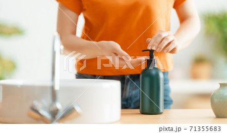 Person is washing hands Person is washing hands 71355683