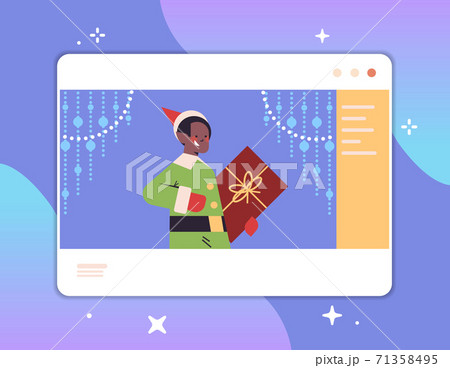 boy elf holding gift box in web browser window happy new year merry christmas holidays celebration concept 71358495