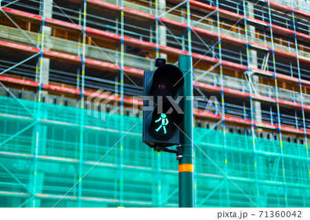 Pedestrian crossing traffic light with green man Pedestrian crossing traffic light with green man 71360042