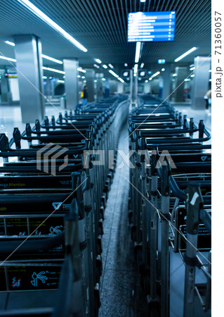 Rows of luggage baskets in the airport terminal. Empty airport 71360057