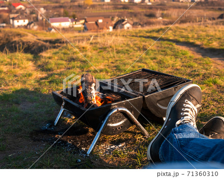 Having a good time barbecuing outdoors on a hike Having a good time barbecuing outdoors on a hike 71360310