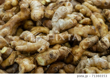 Ginger root counter at grocery store close up 71360353